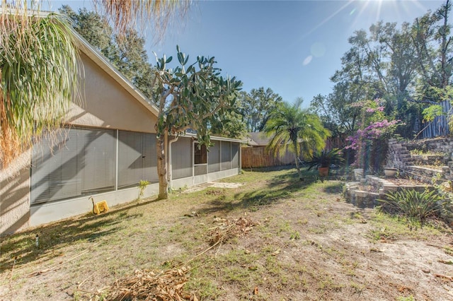 view of yard featuring a sunroom