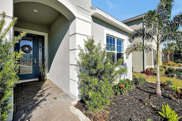 3359 Hanging Tide St, Winter Garden, FL 34787 - doorway to property featuring stucco siding