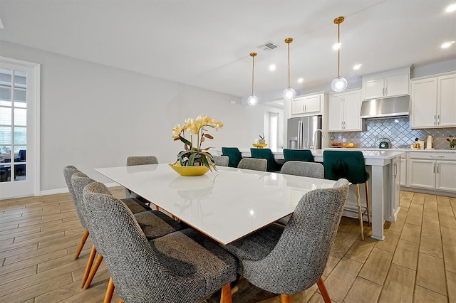 3359 Hanging Tide St, Winter Garden, FL 34787 - dining room with light wood-type flooring and recessed lighting