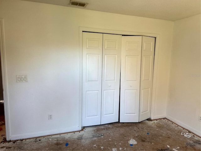 unfurnished bedroom with a closet