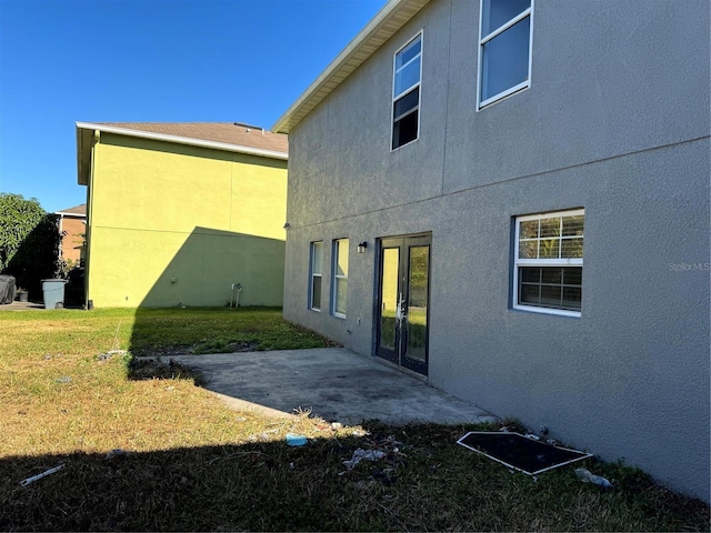 rear view of property featuring a patio