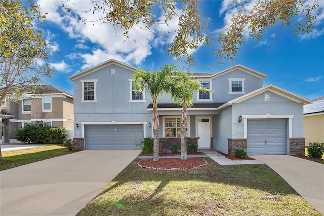 view of front of home featuring a garage and a front lawn