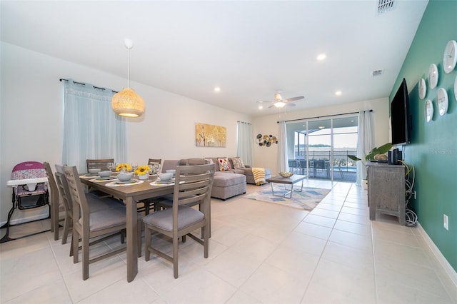 tiled dining room with ceiling fan