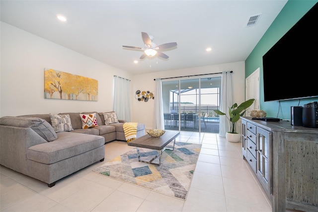 tiled living room with ceiling fan