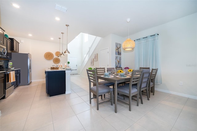 dining area featuring light tile patterned floors