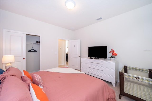 carpeted bedroom with a closet