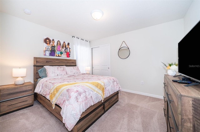 carpeted bedroom with a closet