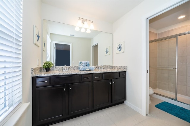 bathroom with toilet, tile patterned floors, a wealth of natural light, and an enclosed shower