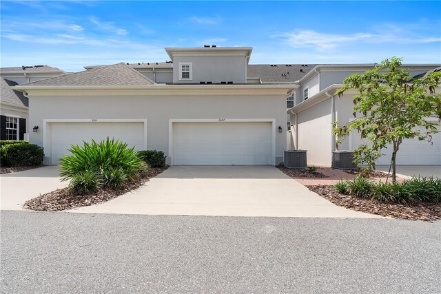 2097 Celebration Blvd, Celebration, FL 34747 - view of front of property featuring stucco siding and concrete driveway