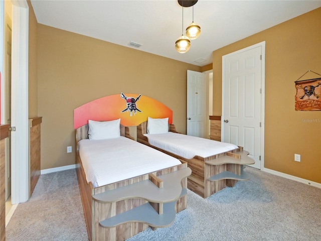 bedroom featuring light colored carpet