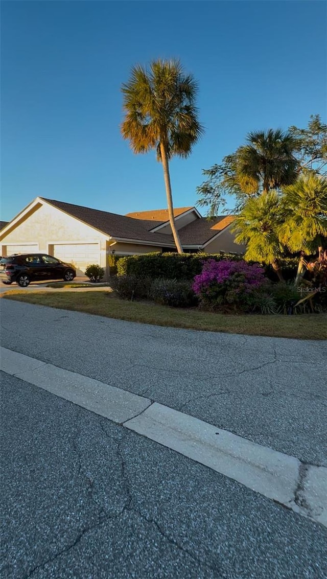 view of side of property featuring a garage