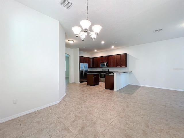 kitchen featuring appliances with stainless steel finishes, open floor plan, visible vents, and a chandelier