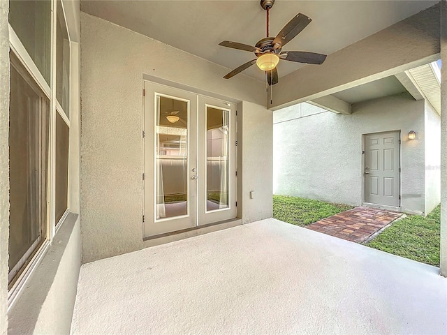 view of patio featuring ceiling fan and french doors