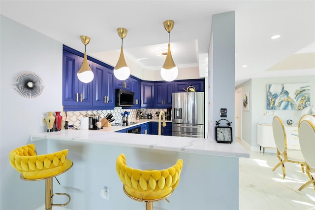 kitchen featuring backsplash, a kitchen breakfast bar, blue cabinets, kitchen peninsula, and stainless steel appliances