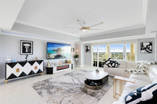 living room featuring ceiling fan and ornamental molding