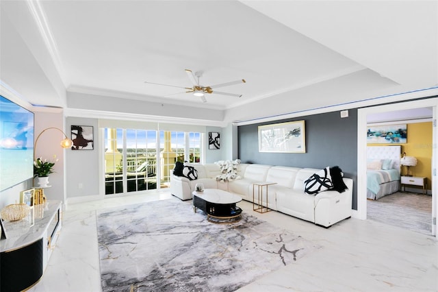 living room featuring ceiling fan and ornamental molding