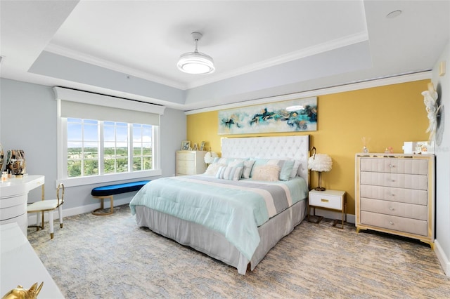 bedroom featuring carpet floors, a raised ceiling, and ornamental molding