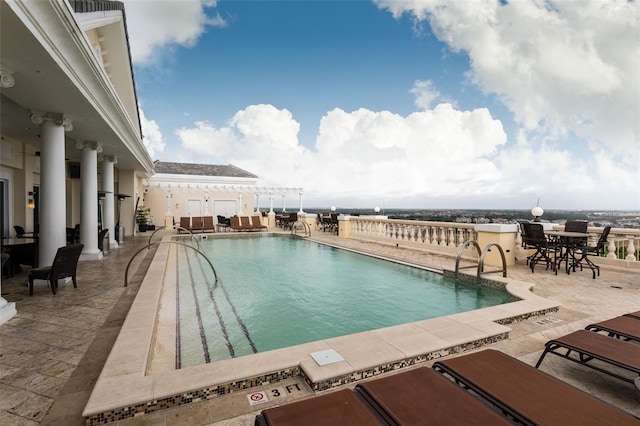 view of swimming pool featuring a patio