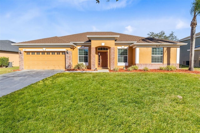 view of front of home featuring a front lawn and a garage