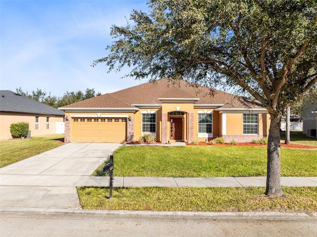 ranch-style home with a garage and a front lawn