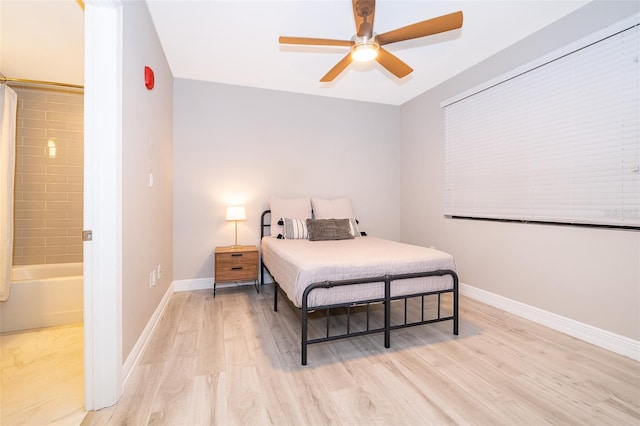 bedroom with light wood-type flooring and ceiling fan