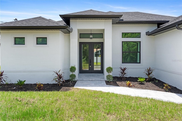 doorway to property with a yard