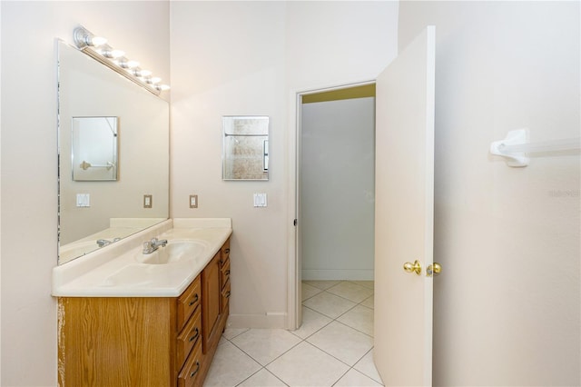 bathroom with tile patterned flooring and vanity