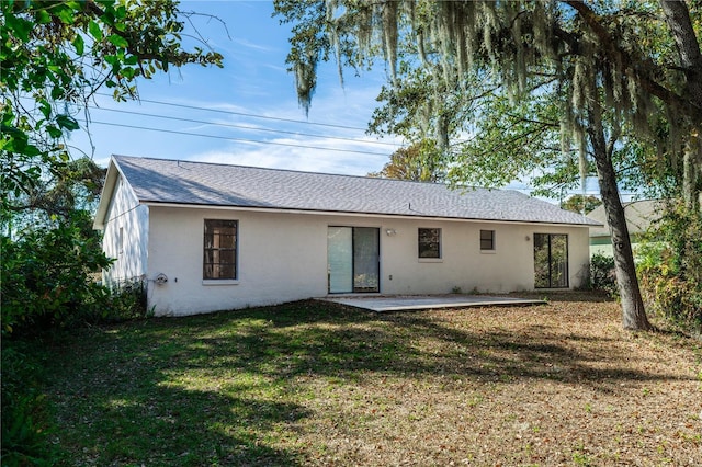 rear view of property with a patio area and a yard