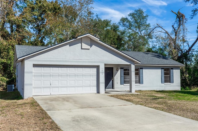 ranch-style house with a front yard, a garage, and central AC unit