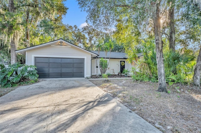 ranch-style house featuring a garage