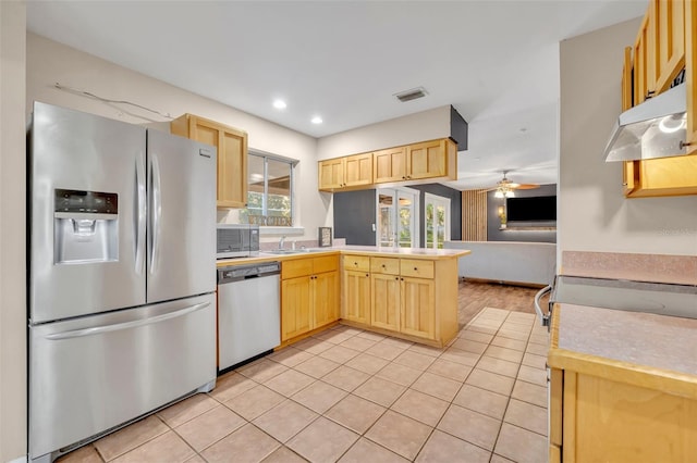 kitchen with ceiling fan, light brown cabinets, light tile patterned floors, and appliances with stainless steel finishes