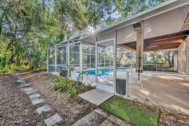 view of swimming pool with a lanai