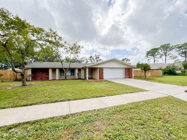 single story home featuring a garage and a front lawn