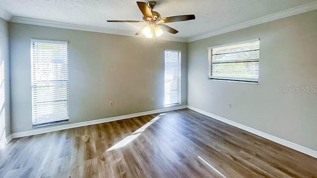 unfurnished room with crown molding, a textured ceiling, and hardwood / wood-style flooring