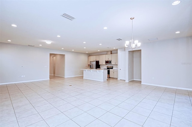 unfurnished living room with light tile patterned floors and a notable chandelier