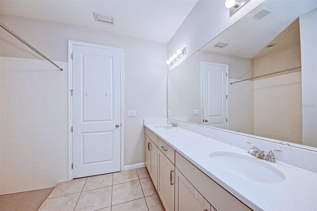 bathroom with tile patterned flooring and vanity