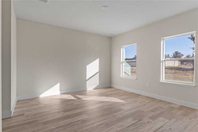 unfurnished room featuring light wood-type flooring