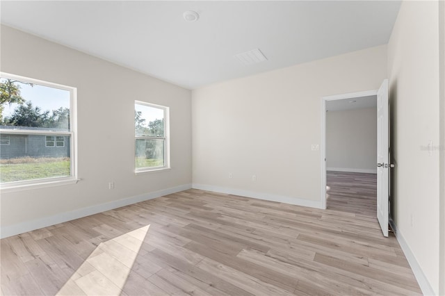 unfurnished room with light hardwood / wood-style flooring