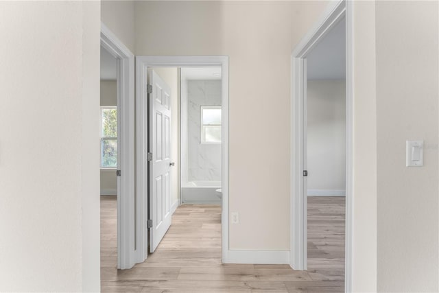 hallway with light wood-type flooring