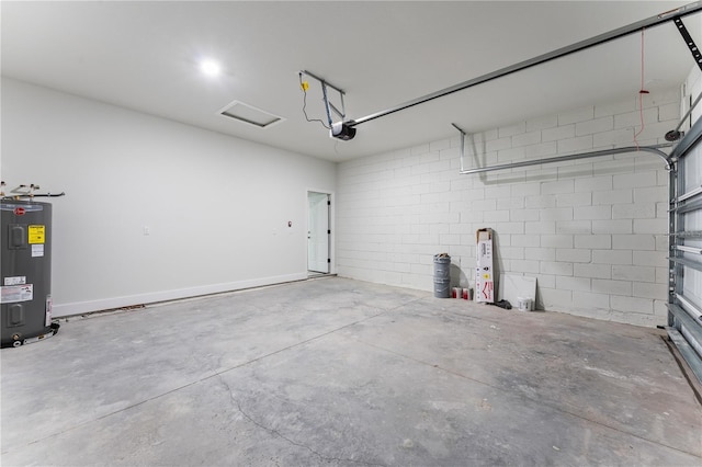 garage featuring electric water heater and a garage door opener