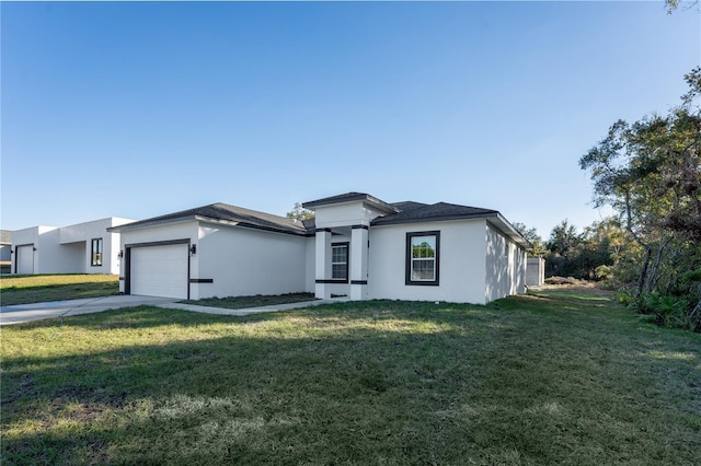 view of front of house featuring a garage and a front lawn