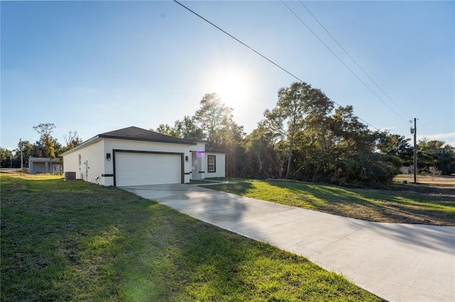 view of front of house with a front yard and a garage