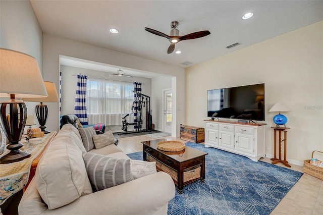 living room featuring light tile patterned floors and ceiling fan