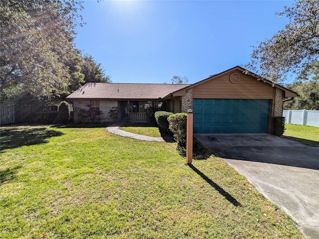 ranch-style house with a front yard and a garage