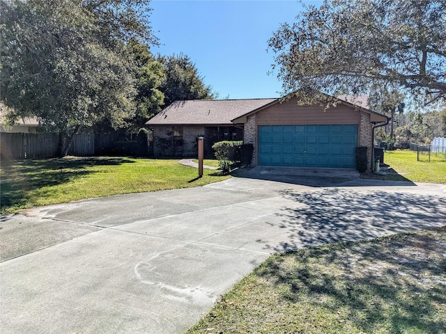 single story home featuring a garage and a front lawn