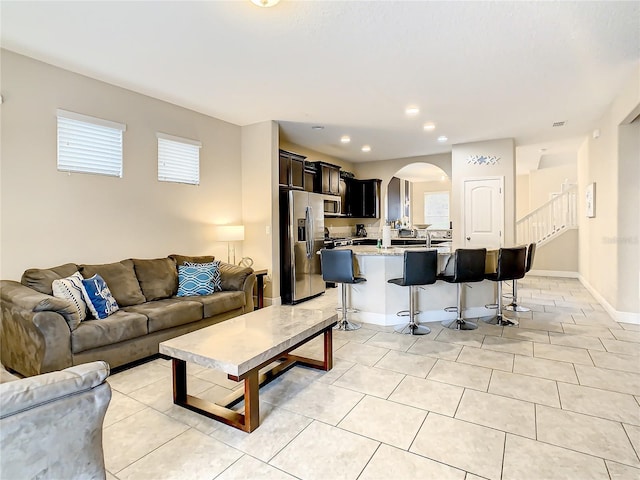 living room featuring light tile patterned flooring