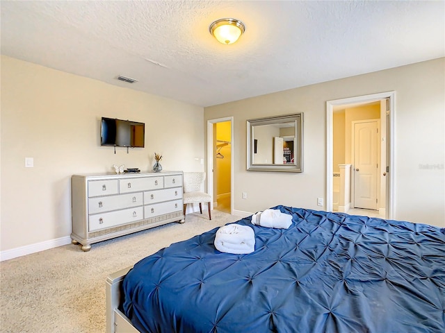 carpeted bedroom featuring a textured ceiling