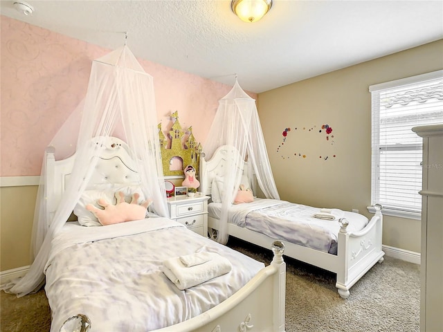 carpeted bedroom featuring a textured ceiling