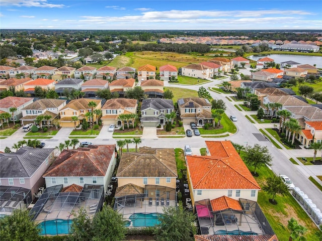 5303 Wildwood Way, Davenport, FL 33837 - aerial view of residential area with a pool area and a large body of water