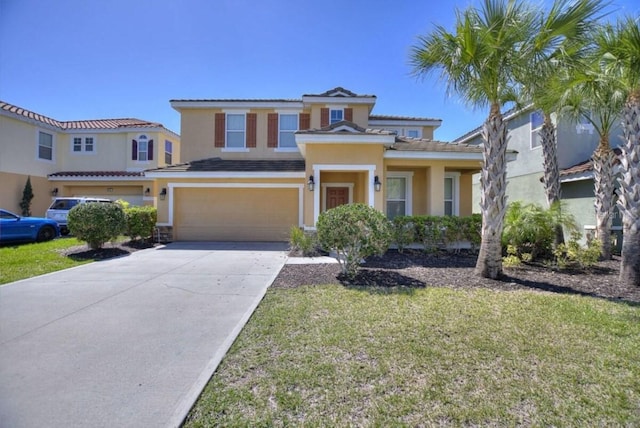 view of front of house with a front yard and a garage